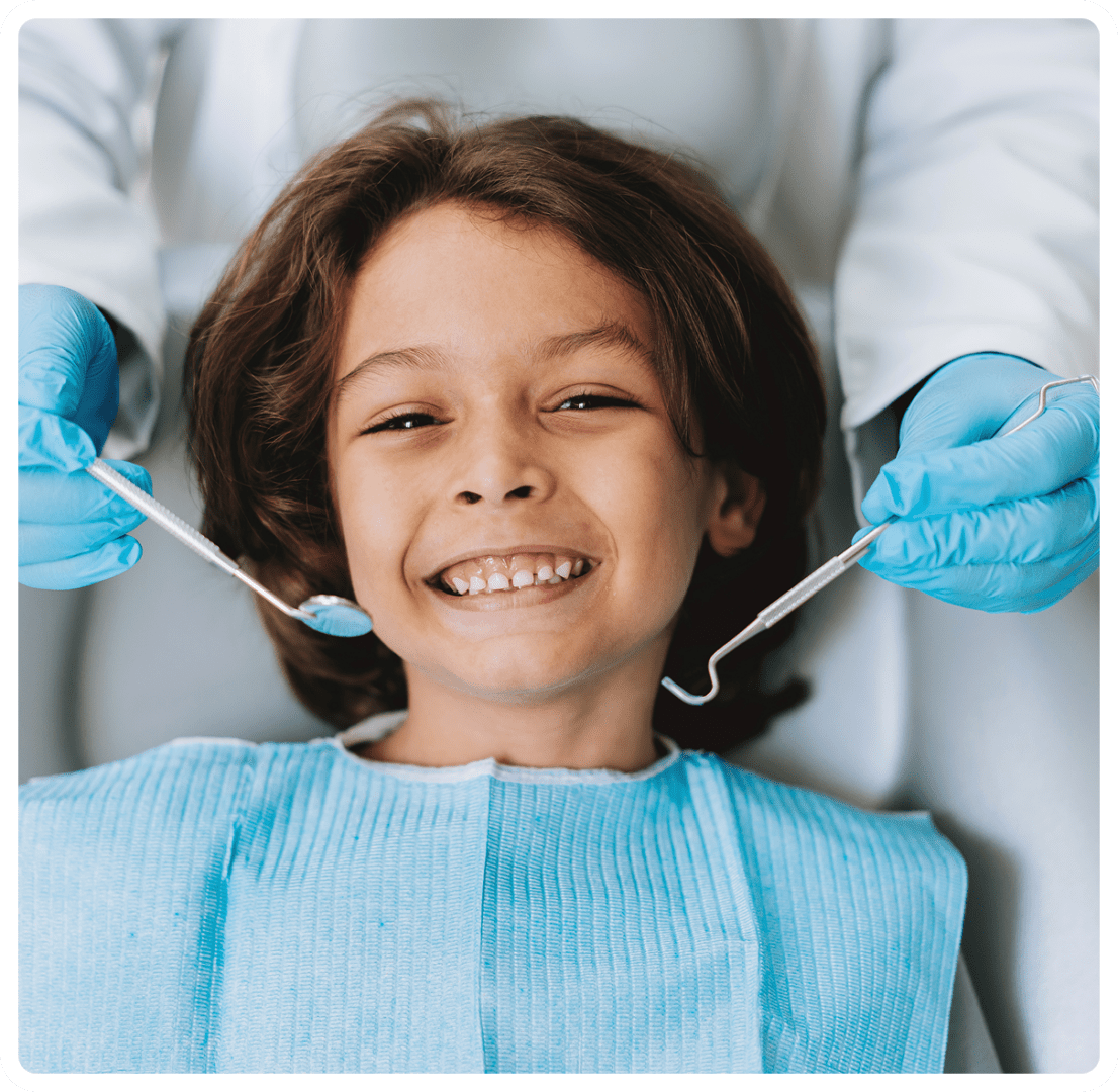 Happy kid with dental tools
